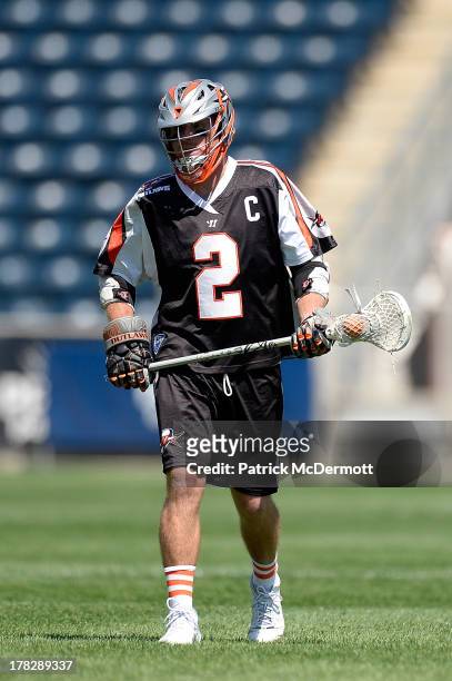 Brendan Mundorf of the Denver Outlaws controls the ball against the Charlotte Hounds during the 2013 MLL Semifinal game at PPL Park on August 24,...