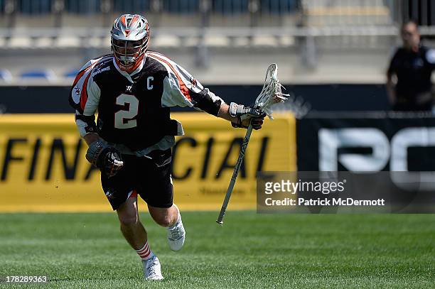 Brendan Mundorf of the Denver Outlaws controls the ball against the Charlotte Hounds during the 2013 MLL Semifinal game at PPL Park on August 24,...