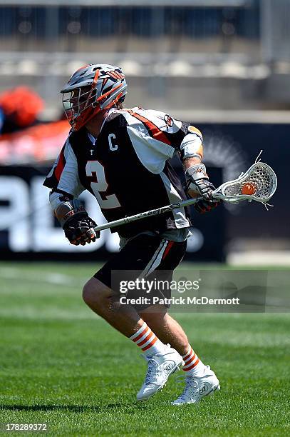 Brendan Mundorf of the Denver Outlaws controls the ball against the Charlotte Hounds during the 2013 MLL Semifinal game at PPL Park on August 24,...