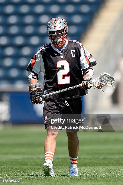 Brendan Mundorf of the Denver Outlaws controls the ball against the Charlotte Hounds during the 2013 MLL Semifinal game at PPL Park on August 24,...