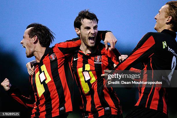 Thijs van der Velden of Rosmalen celebrates scoring the first goal of the game with team mates during the First round Dutch Cup match between OJC...