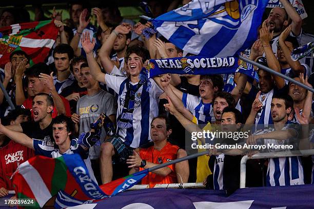 Real Sociedad fans celebrate their victory after the UEFA Champions League Play-offs second leg match between Real Sociedad and Olympique Lyonnais at...