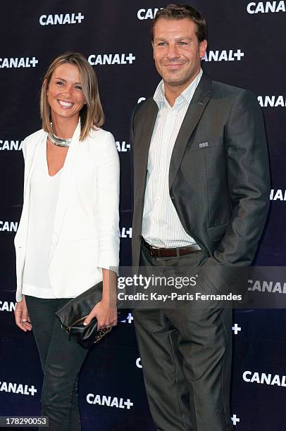 Sports journalist Isabelle Ithurburu and Rugby union player Thomas Lombard , at the 'Rentree De Canal +' photocall at Porte De Versailles on August...