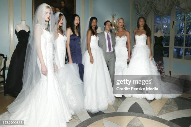 Zac Posen and models on the catwalk