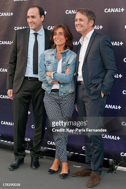 Messaoud Benterki , Journalist Nathalie Iannetta and Eric Besnard at the 'Rentree De Canal +' photocall at Porte De Versailles on August 28, 2013 in...