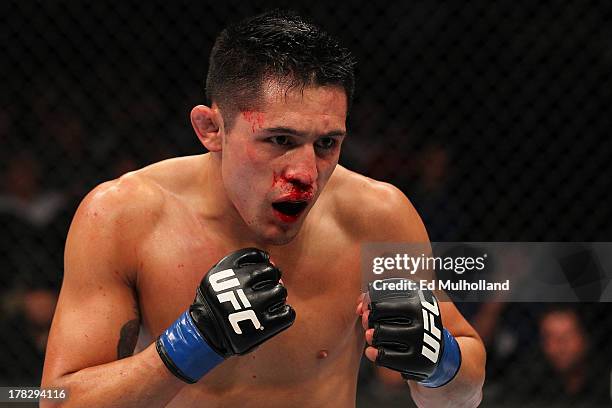 Erik Perez stands in the Octagon during his bantamweight fight against Takeya Mizugaki during the UFC on FOX Sports 1 event at Bankers Life...