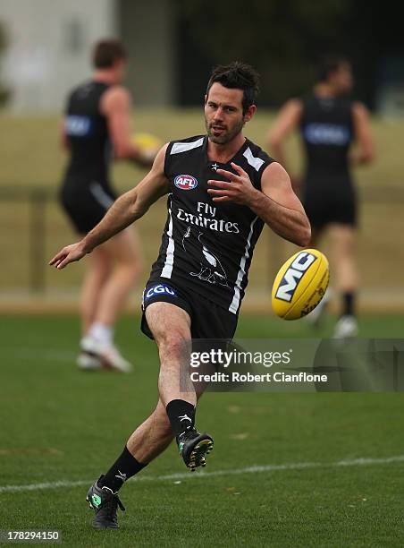 Alan Didak of the Magpies kicks the ball during a Collingwood Magpies AFL training session at Olympic Park on August 29, 2013 in Melbourne, Australia.