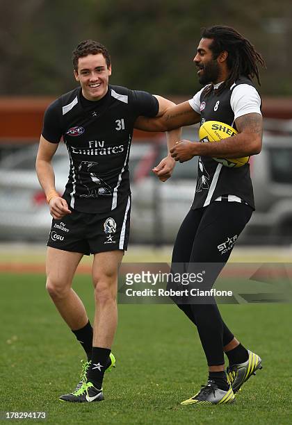 Jackson Ramsay and Heritier O'Brien of the Magpies wrestle during a Collingwood Magpies AFL training session at Olympic Park on August 29, 2013 in...