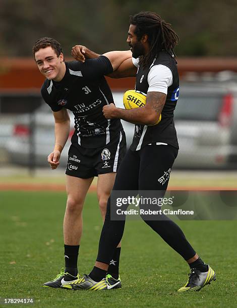 Jackson Ramsay and Heritier O'Brien of the Magpies wrestle during a Collingwood Magpies AFL training session at Olympic Park on August 29, 2013 in...