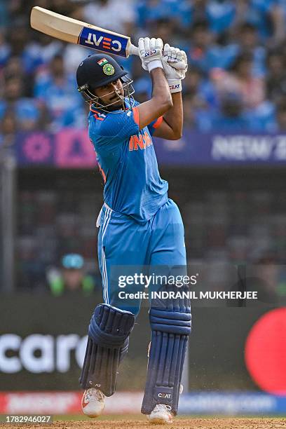 India's Shreyas Iyer plays a shot during the 2023 ICC Men's Cricket World Cup one-day international first semi-final match between India and New...
