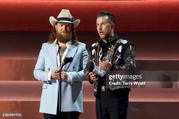 John Osborne and T.J. Osborne of The Brothers Osborne accept the Vocal Duo of the Year award onstage during the 57th Annual CMA Awards at Bridgestone...