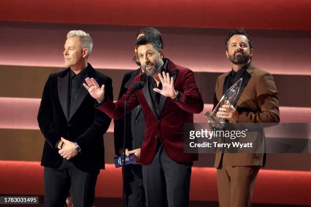 Trevor Rosen, Matthew Ramsey and Brad Tursi of Old Dominion accept the award for Vocal Group of the Year onstage during the 57th Annual CMA Awards at...