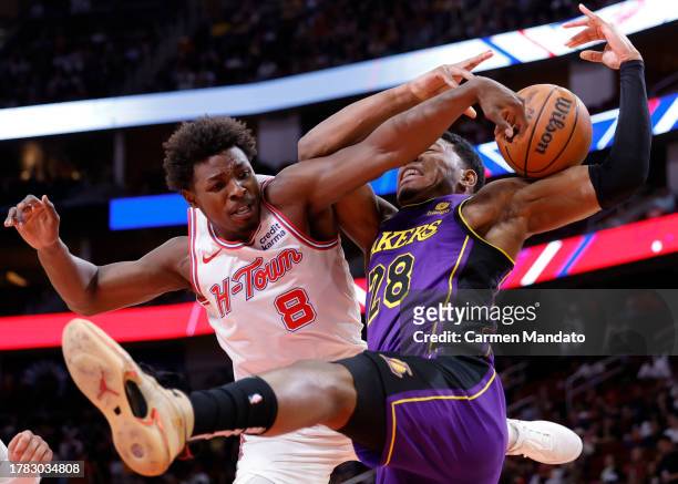 Jae'Sean Tate of the Houston Rockets collides with Rui Hachimura of the Los Angeles Lakers during the first half at Toyota Center on November 08,...