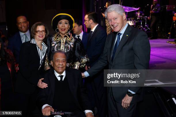 Michelle Nunn, Carolyn and Andrew Young and Former President Bill Clinton attend the CARE Impact Awards 2023 at The Ziegfeld Ballroom on November 08,...