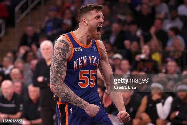 Isaiah Hartenstein of the New York Knicks celebrates a dunk against the San Antonio Spurs during the third quarter in the game at Madison Square...