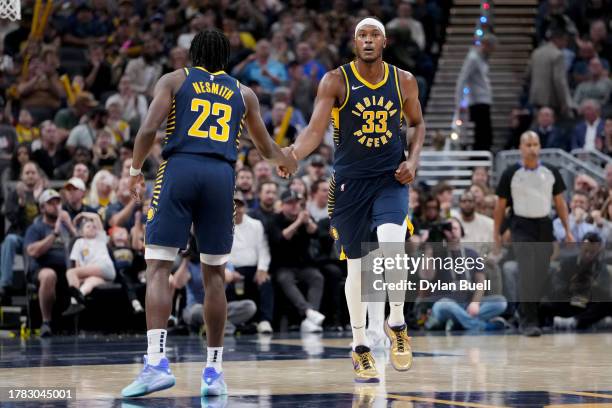 Aaron Nesmith and Myles Turner of the Indiana Pacers celebrate in the third quarter against the Utah Jazz at Gainbridge Fieldhouse on November 08,...