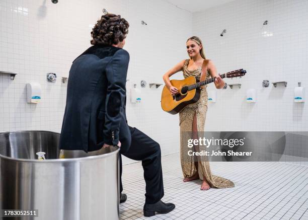 Kelsea Ballerini serenades Chase Stokes backstage at the 57th Annual Country Music Association Awards at Bridgestone Arena on November 08, 2023 in...