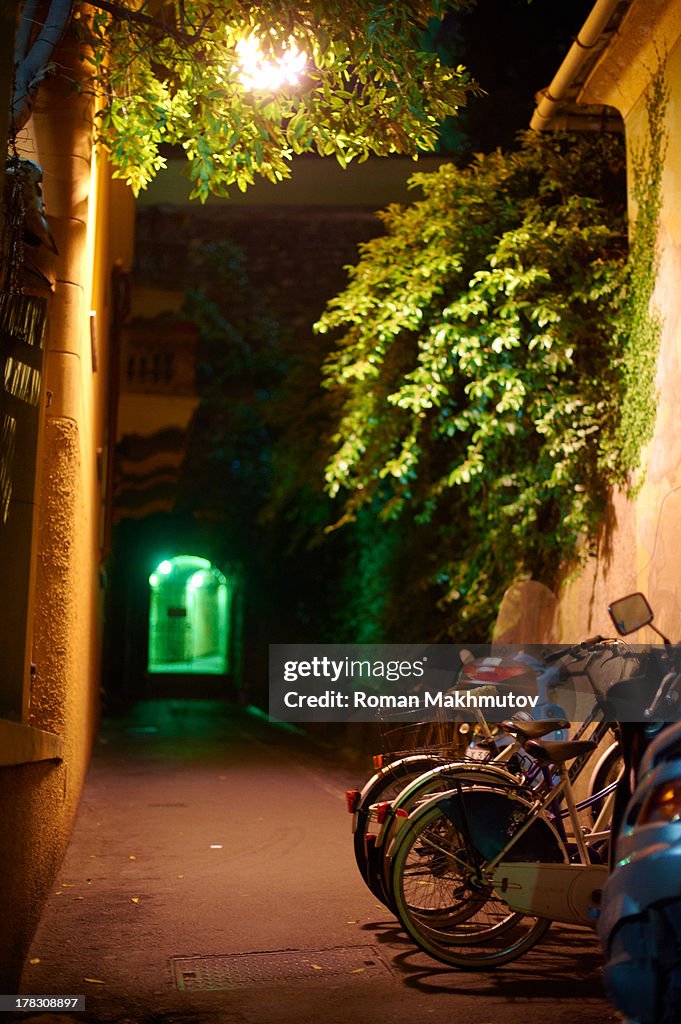 Bicycle parking in night alley