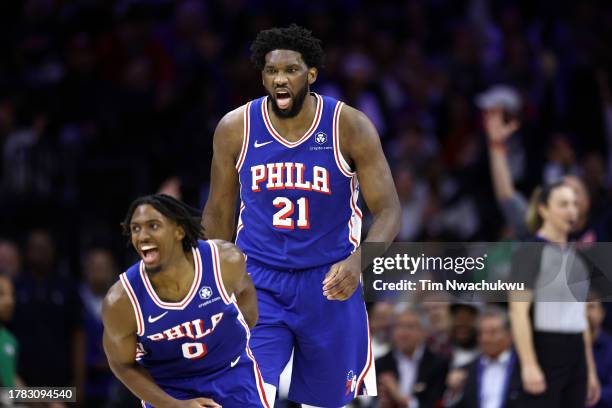 Joel Embiid and Tyrese Maxey of the Philadelphia 76ers react during the fourth quarter against the Boston Celtics at the Wells Fargo Center on...