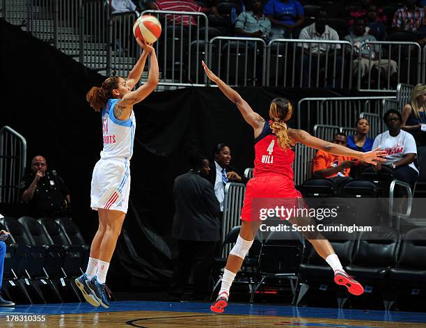 Courtney Clements of the Atlanta Dream puts up a shot against the Washington Mystics at Philips Arena on August 28 2013 in Atlanta, Georgia. NOTE TO...