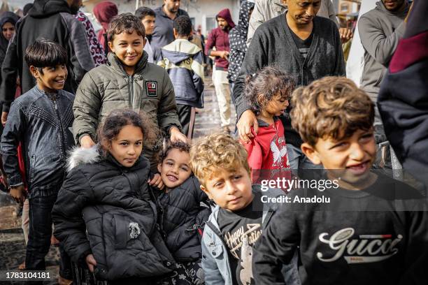 Children are seen at the United Nations Relief and Works Agency refugee camp located in Khan Yunis, Gaza where displaced Palestinian families take...