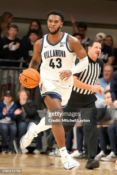 Eric Dixon of the Villanova Wildcats dribbles up court during a college basketball game against the American University Eagles at Finnegan Fieldhouse...