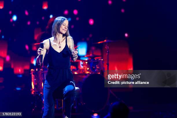 November 2023, Baden-Württemberg, Offenburg: Christina Stürmer performs on stage during the recording of "Die große Silvester Show". The Eurovision...