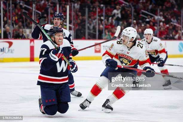 Oshie of the Washington Capitals reacts after blocking the shot of Josh Mahura of the Florida Panthers as Dylan Strome of the Washington Capitals...