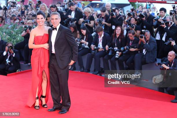 Actor George Clooney and actress Sandra Bullock attend "Gravity" Premiere and Opening Ceremony during the 70th Venice International Film Festival at...