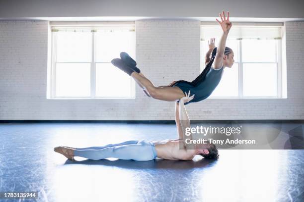 one male and one non-binary dancer rehearsing in ballet studio - tights stock pictures, royalty-free photos & images