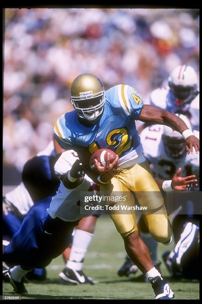 Running back Skip Hicks of UCLA carries the football during the... News