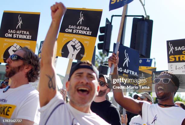 Members and supporters chant outside Paramount Studios on day 118 of their strike against the Hollywood studios on November 8, 2023 in Los Angeles,...