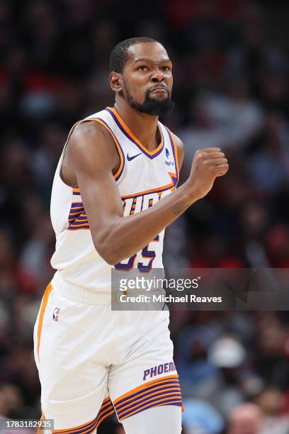 Kevin Durant of the Phoenix Suns celebrates a basket against the Chicago Bulls during the second half at the United Center on November 08, 2023 in...