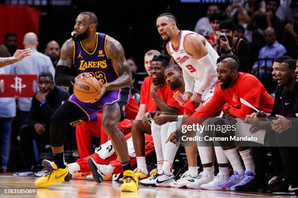 Dillon Brooks of the Houston Rockets speaks to LeBron James of the Los Angeles Lakers during the second half at Toyota Center on November 08, 2023 in...