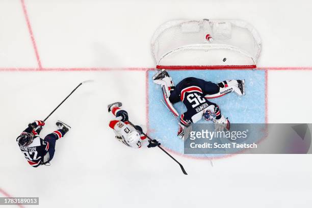 Sam Reinhart of the Florida Panthers scores the game winning goal against Darcy Kuemper of the Washington Capitals during overtime of the game at...