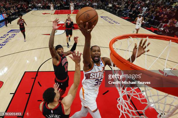Kevin Durant of the Phoenix Suns goes up for a layup against Zach LaVine of the Chicago Bulls during the second half at the United Center on November...