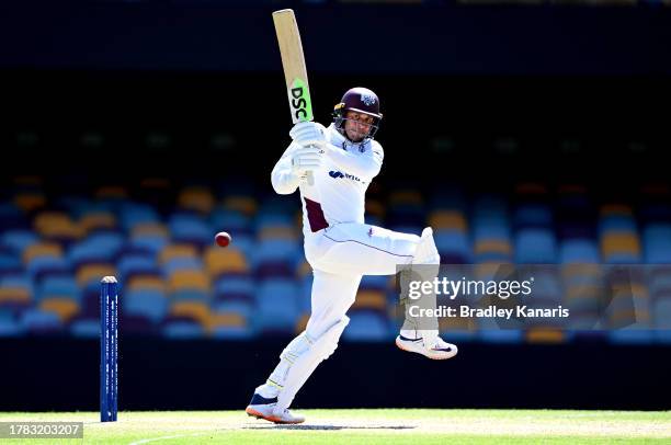 Usman Khawaja of Queensland hits the ball to the boundary for a four during day four of the Sheffield Shield match between Queensland and South...