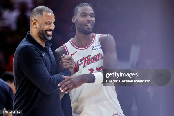 Tari Eason of the Houston Rockets high fives head coach Ime Udoka during the second half at Toyota Center on November 08, 2023 in Houston, Texas....