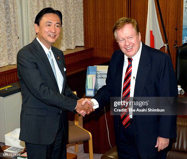 Special envoy for North Korean human rights issues Robert King and Japanese Abduction issue minister Keiji Furuya shake hands during their meeting on...