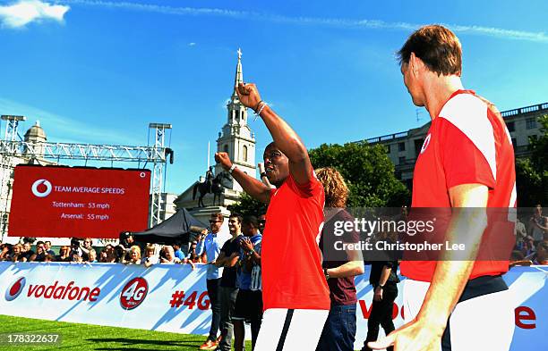 Ex Arsenal Legend Ian Wright and Tony Adams celebrate their victory during the Vodafone 4G Goes Live Launch at Trafalgar Sq on August 29, 2013 in...