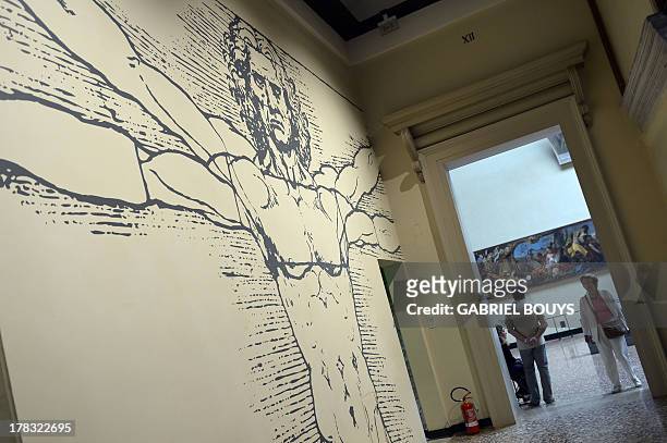 People visit an exhibition of drawings by Leonardo da Vinci, on August 2ç, 2013 in Venice. Fifty-two drawings by Renaissance genius Leonardo da Vinci...