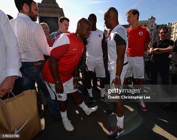 Ex Arsenal Legend Ian Wright stretches with Ex Tottenham Hotspur legend's Ledley King and Les Ferdinand and also Tony Adams during the Vodafone 4G...