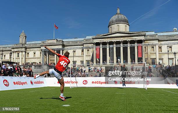 Ex Arsenal Legend Tony Adams blasts a penalty shot during the Vodafone 4G Goes Live Launch at Trafalgar Sq on August 29, 2013 in London, England....