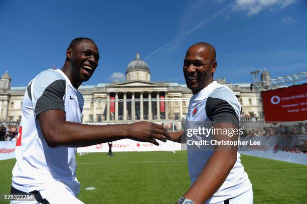 Ex Tottenham Hotspur Legends Ledley King and Les Ferdinand laugh during the Vodafone 4G Goes Live Launch at Trafalgar Sq on August 29, 2013 in...