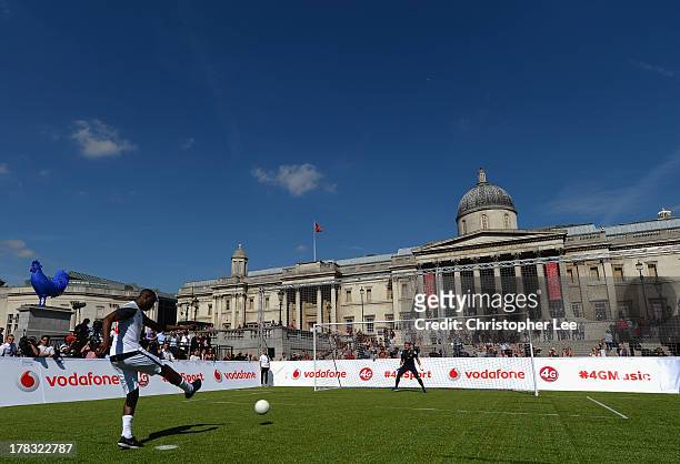 Ex Tottenham Hotspur legend Ledley King blasts a penalty shot during the Vodafone 4G Goes Live Launch at Trafalgar Sq on August 29, 2013 in London,...