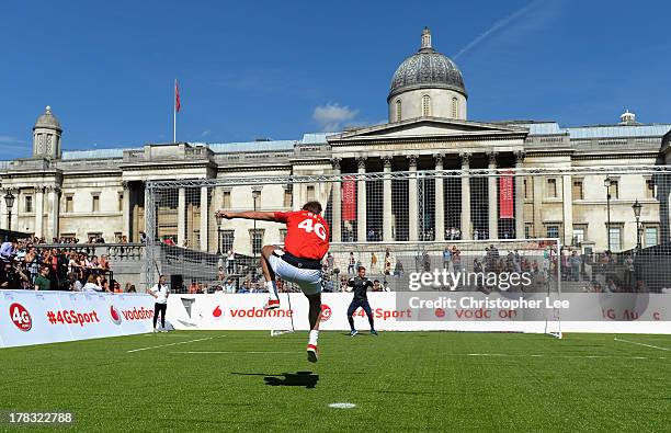 Ex Arsenal Legend Tony Adams blasts a penalty shot during the Vodafone 4G Goes Live Launch at Trafalgar Sq on August 29, 2013 in London, England....