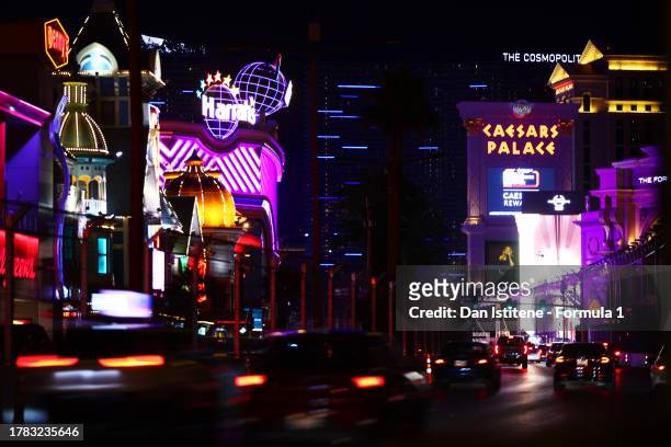 Motorists drive along the Las Vegas Strip, now featuring catch fencing and track lighting infrastructure, prior to the F1 Grand Prix of Las Vegas on...