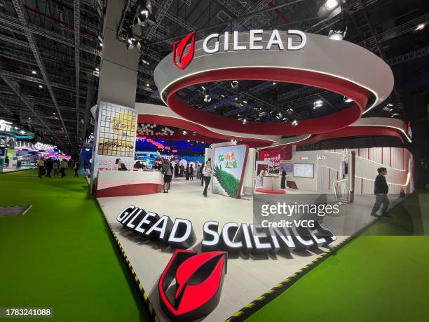 People visit the Gilead Sciences Inc. Booth during the 6th China International Import Expo at the National Exhibition and Convention Center on...