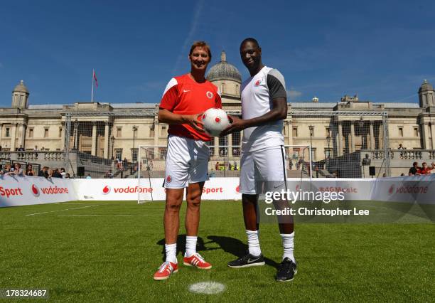 Ex Arsenal Legend Tony Adams with Ex Tottenham Hotspur Legend Ledley King pose for the camera during the Vodafone 4G Goes Live Launch at Trafalgar Sq...