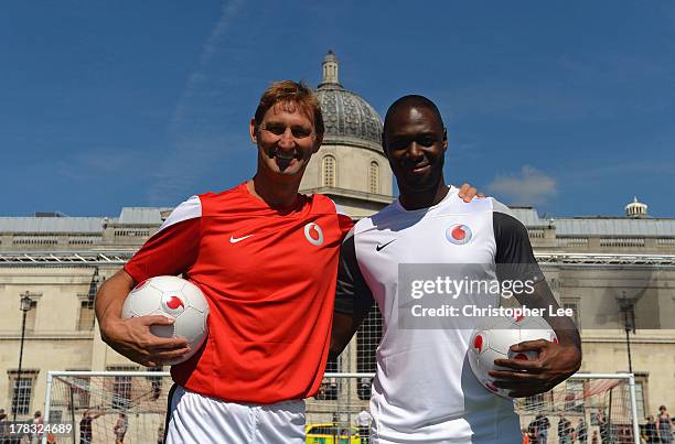 Ex Arsenal Legend Tony Adams with Ex Tottenham Hotspur Legend Ledley King pose for the camera during the Vodafone 4G Goes Live Launch at Trafalgar Sq...